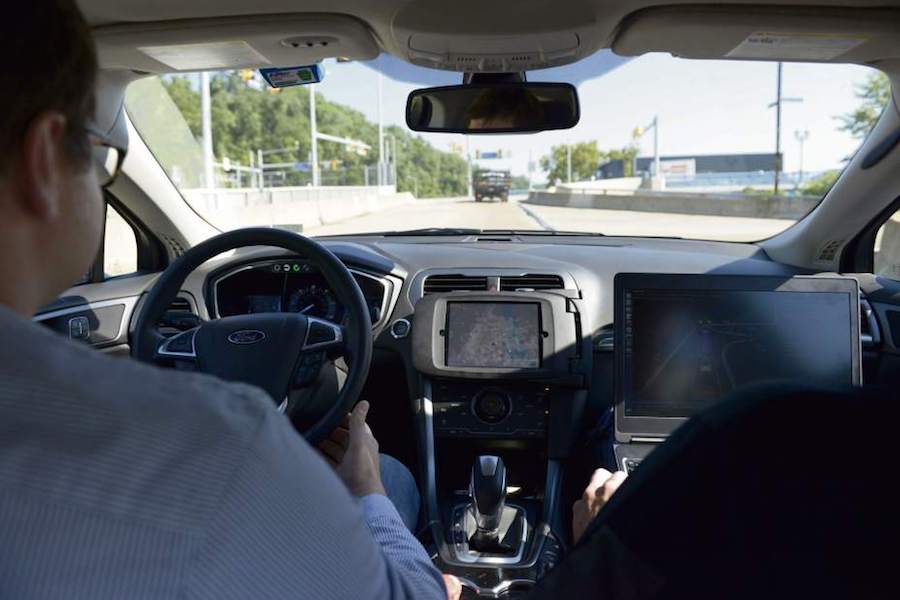 Uber engineers sit behind wheel of autonomous vehicle