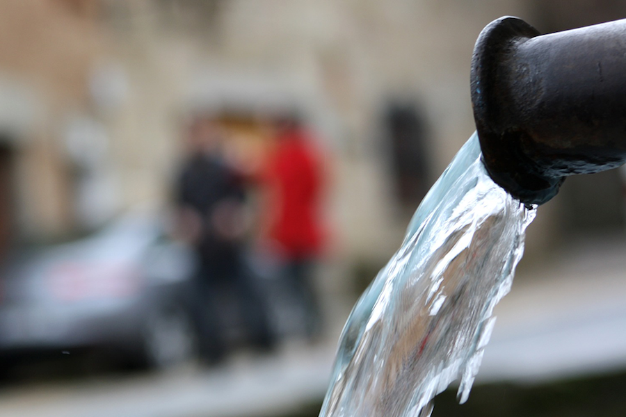 water flowing out of pipe