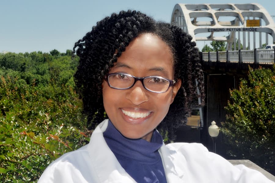 photo of Tiffani Maycock in a lab coat