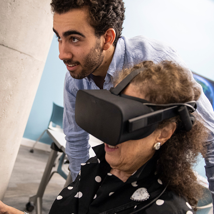 Patti Kenner using virtual reality in Global Languages Room