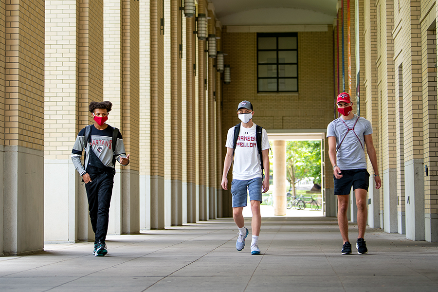 Photo of masked students on campus