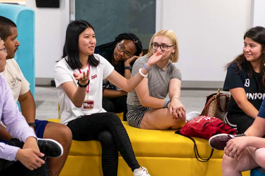 Tartan Scholar students talk in a lobby