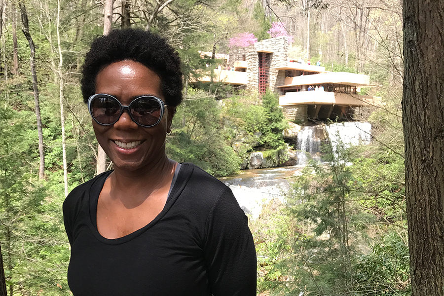 Tricia Nelson standing in front of Falling Water