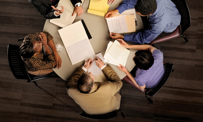 Circle of Professionals Around a Table