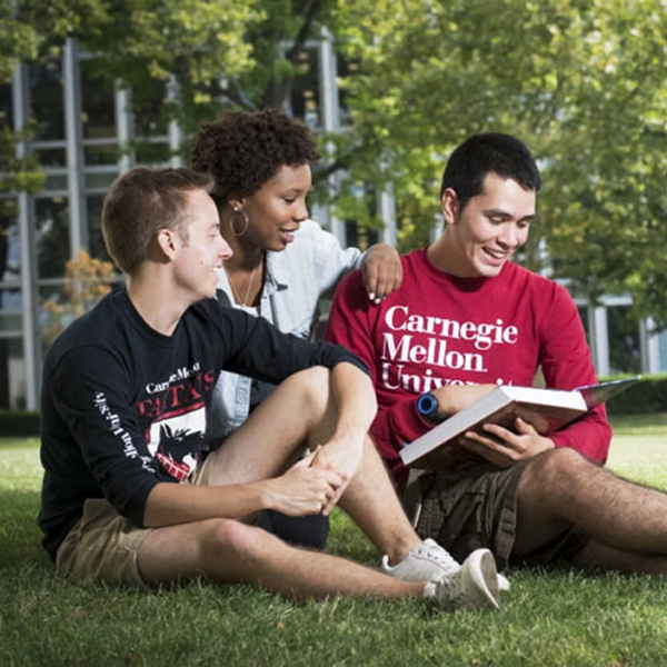 Students on lawn wearing CMU shirts