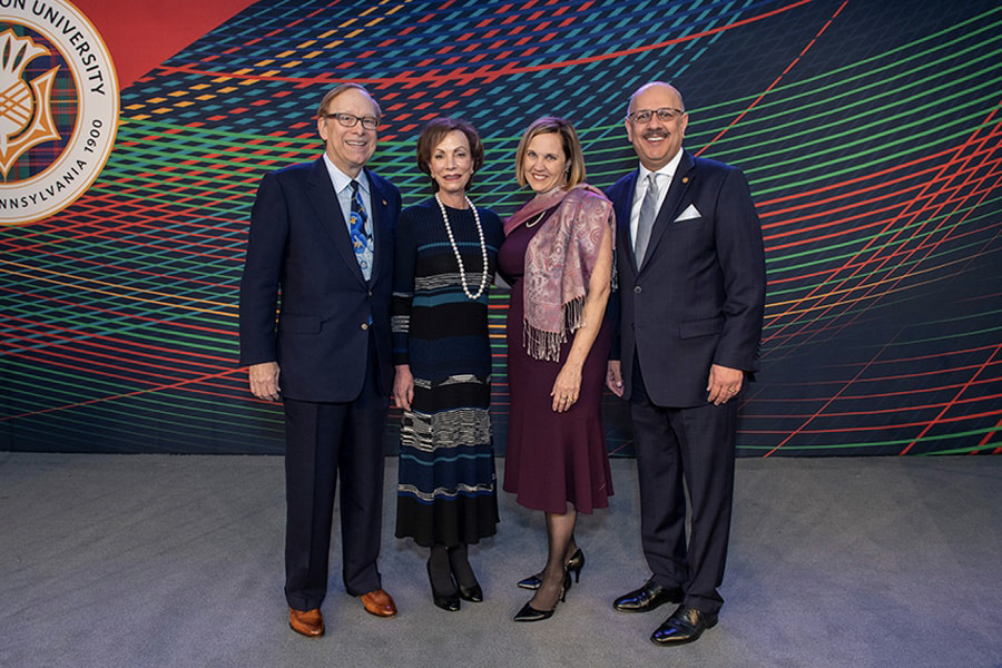 President Jahanian, his wife Tris, Tod and Cindy Johnson