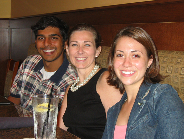 Jennifer and two students at dinner