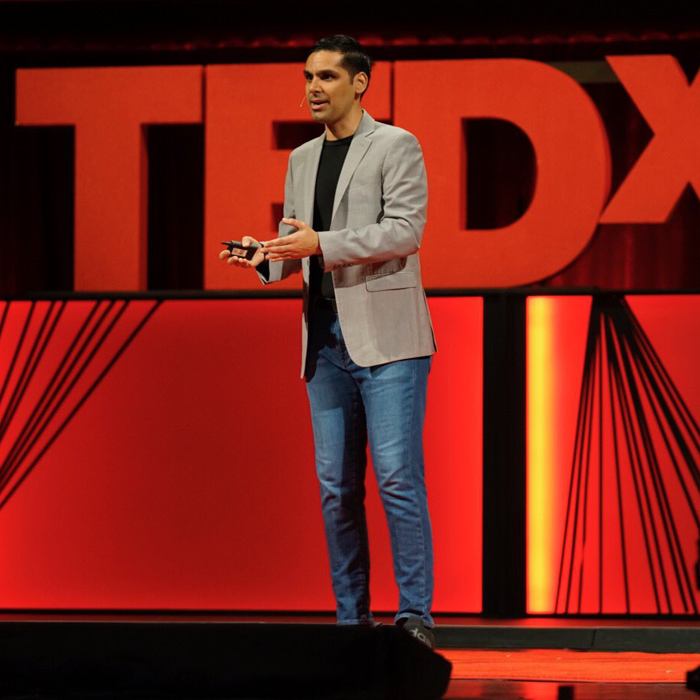 Photo of Anirudh Koul on TedX stage
