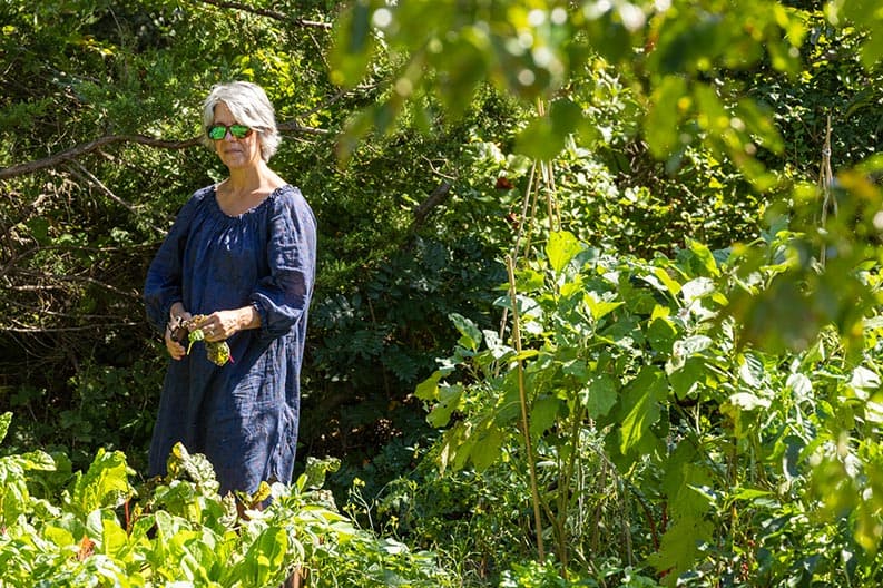 Betty Rexrode standing among vegitation