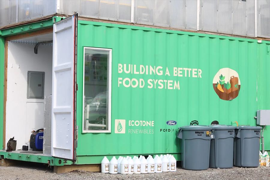 Ecotone Renewables work shed painted with "Building a Better Food System"