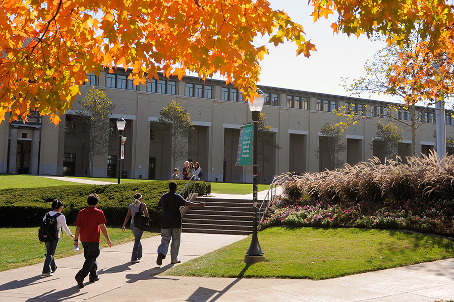 students walking onto campus