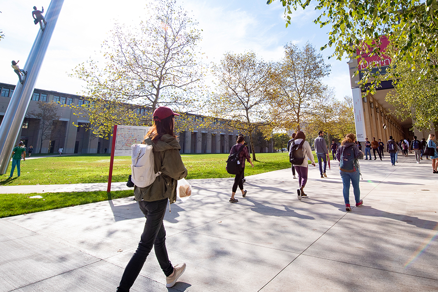 students walking onto campus