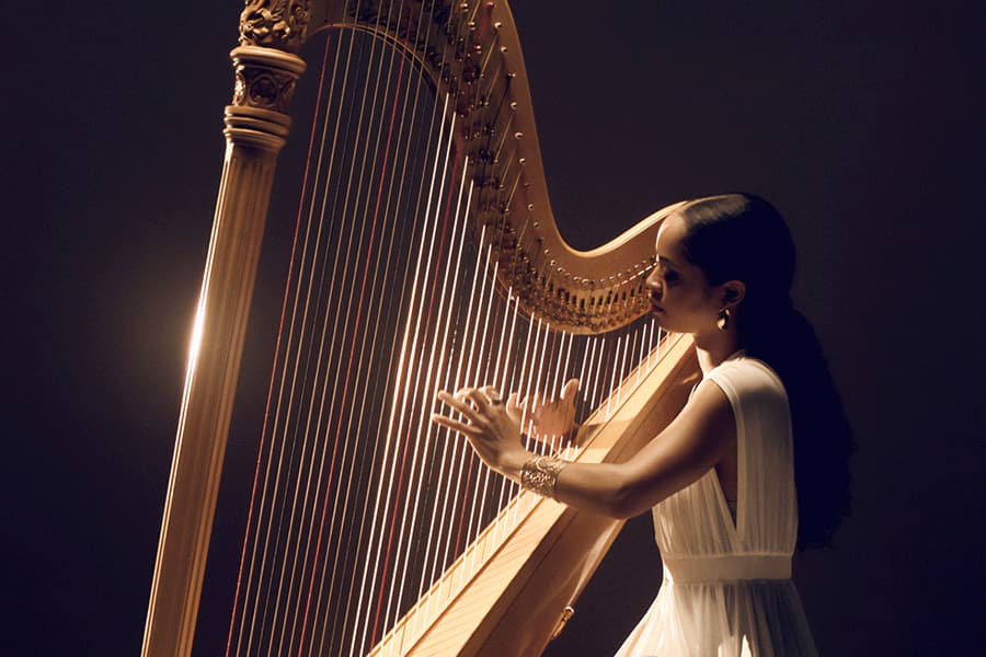 Madison Calley playing the harp