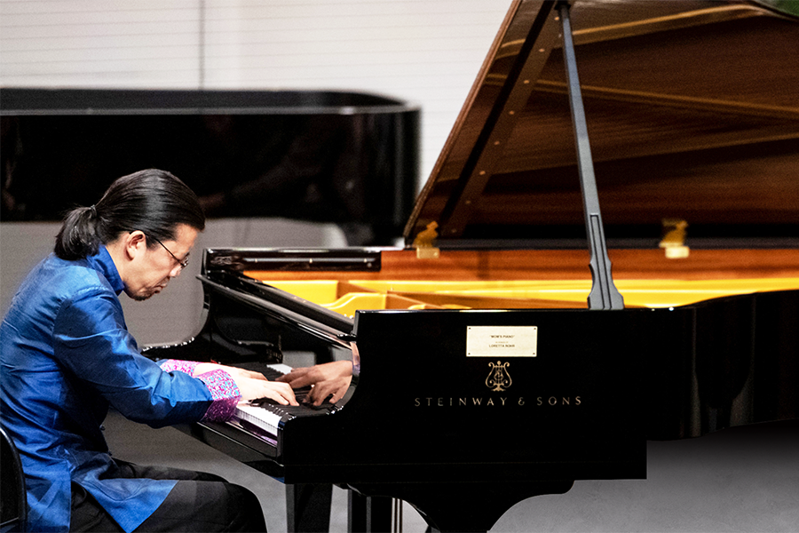 A man performs at a piano