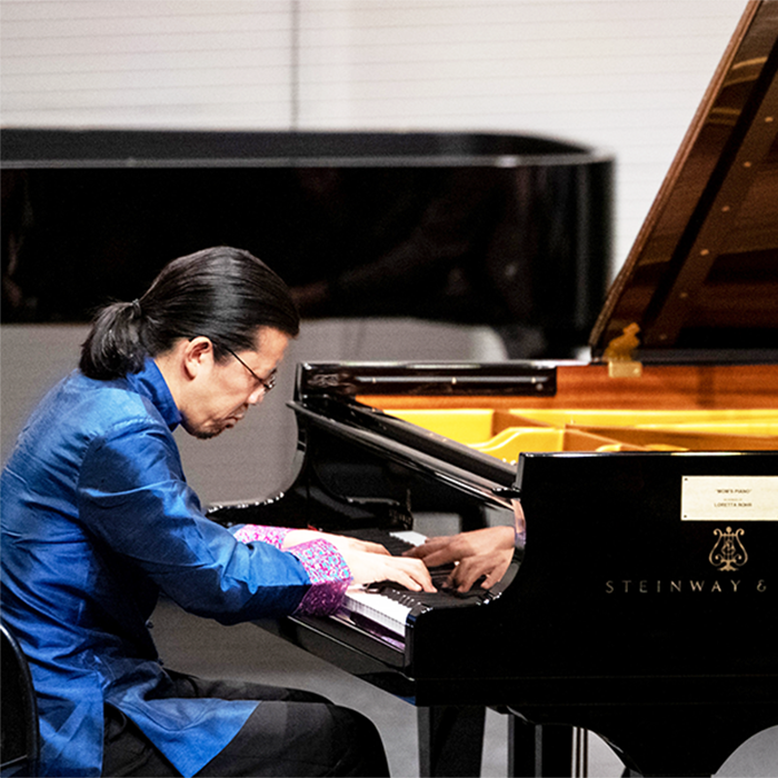 A man performs at a piano