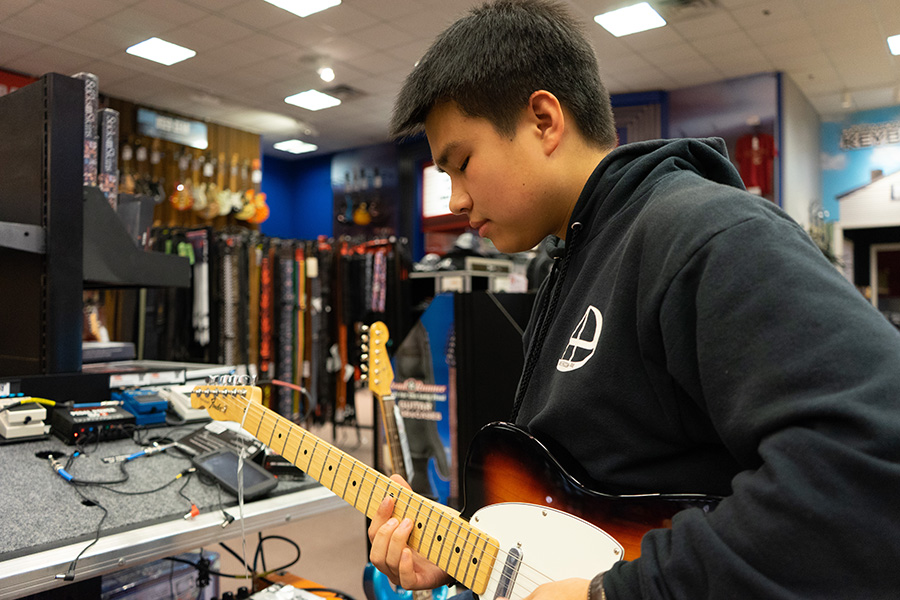 Sam Rainey playing guitar