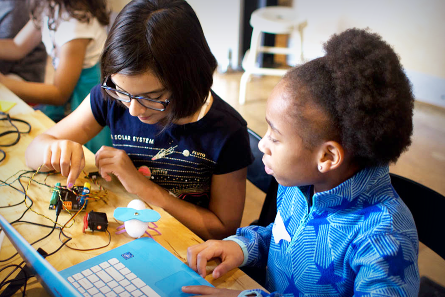 Photo of teacher and student working