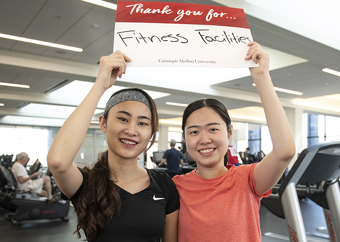 CMU Students Hold Sign Thanking Donors