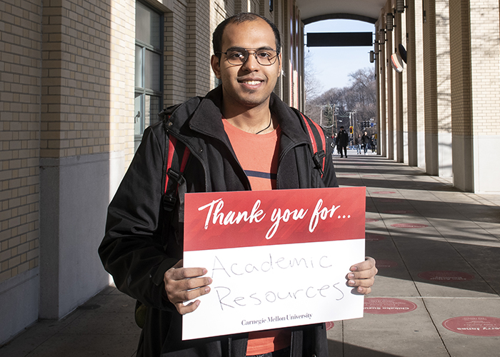 CMU Students Hold Sign Thanking Donors