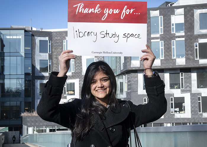 CMU Students Hold Sign Thanking Donors