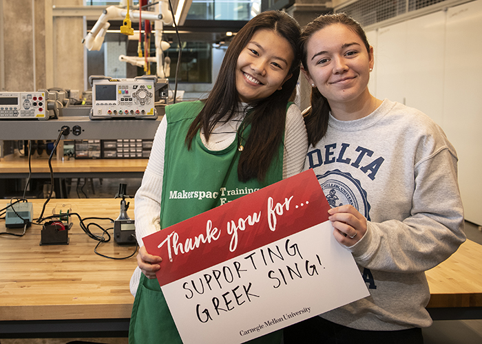 CMU Students Hold Sign Thanking Donors