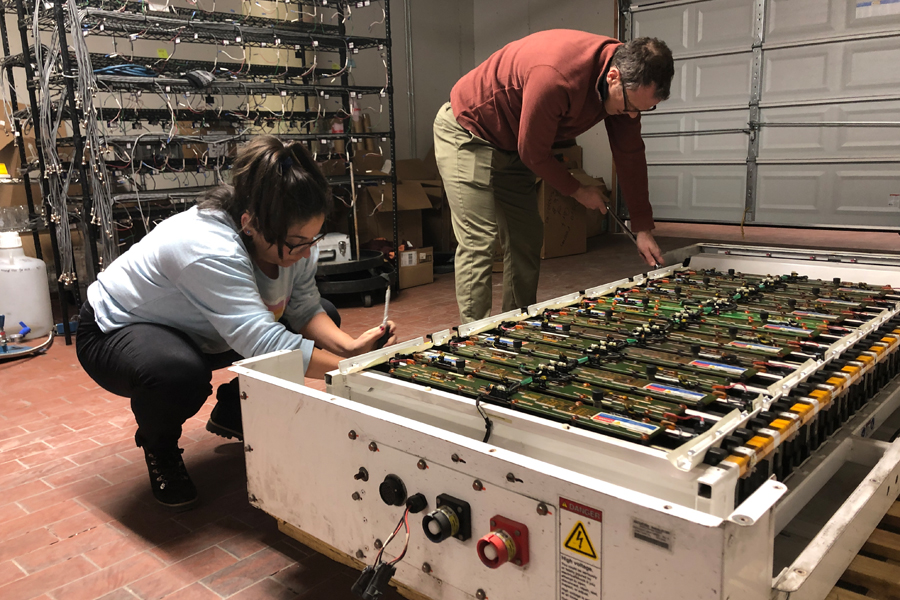 Professor Whitacre and PhD student Katrina Ramirez-Myers work in the laboratory. 