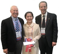 Dai Tang with presenters at AIST 2019 conference