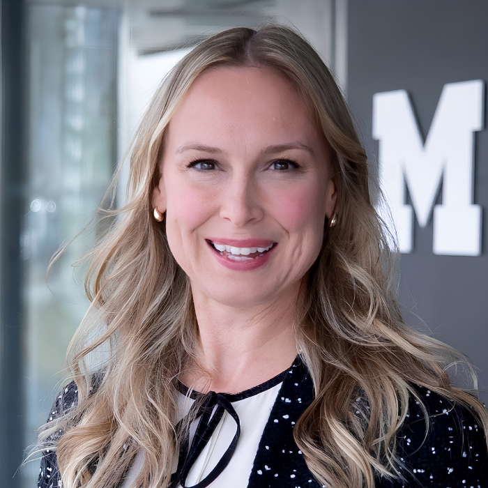 Women with long hair and black and white polka dot blouse