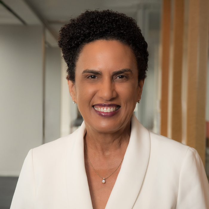 Woman with short hair and white blazer