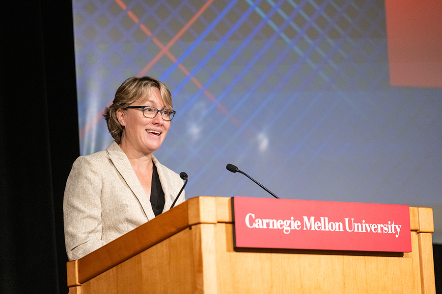 Vice provost for faculty at a podium