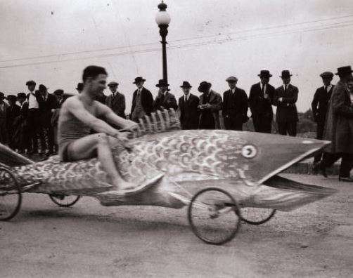a buggy that looks like a fish with a CMU student riding it