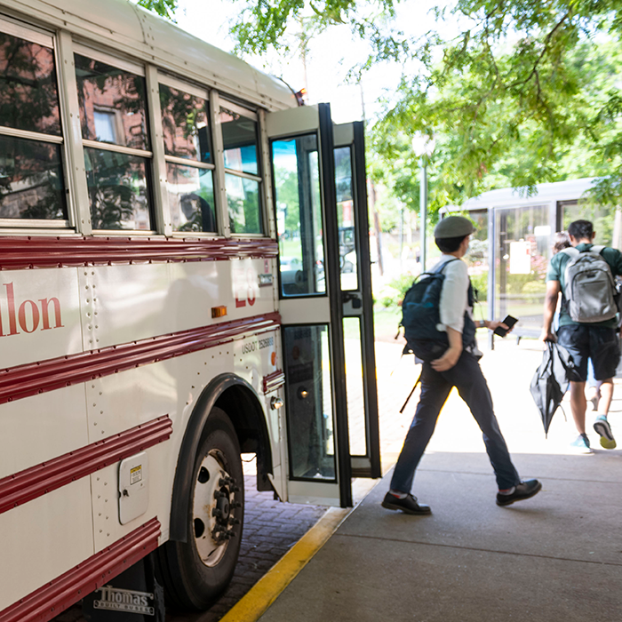 Students exiting a shuttle bus