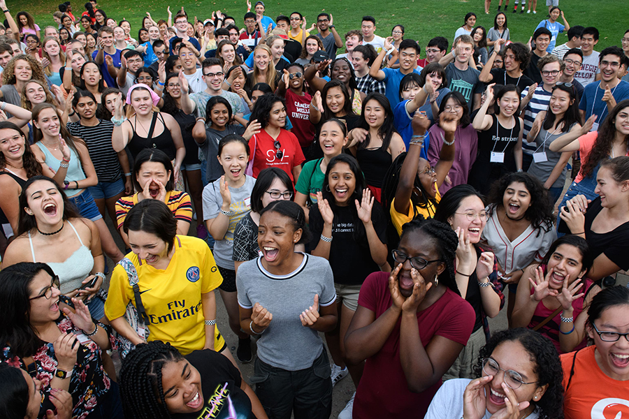 a group of students screaming and smiling