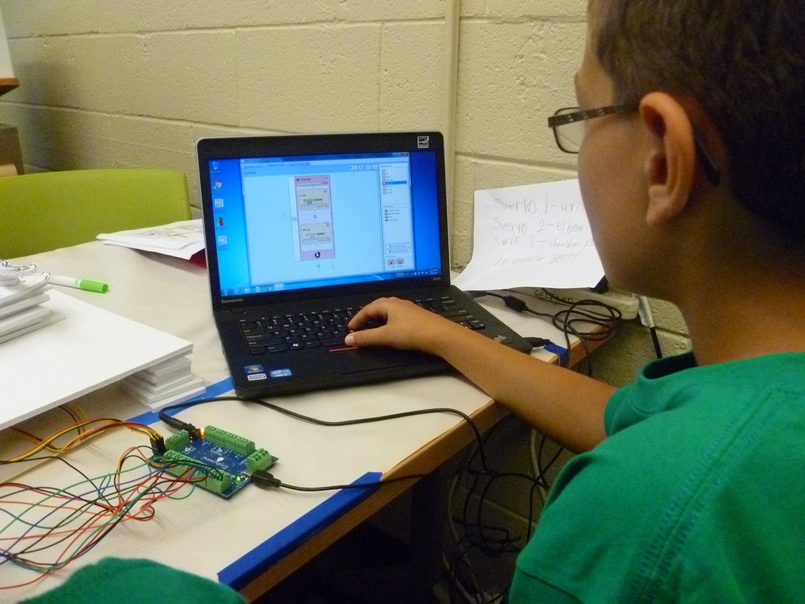 A student working on a laptop during a workshop