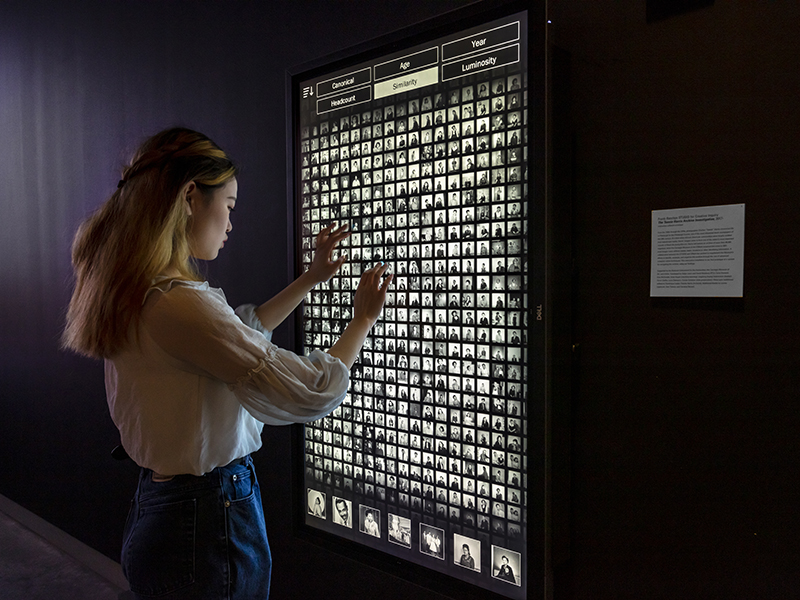 A student looks at an interactive exhibit