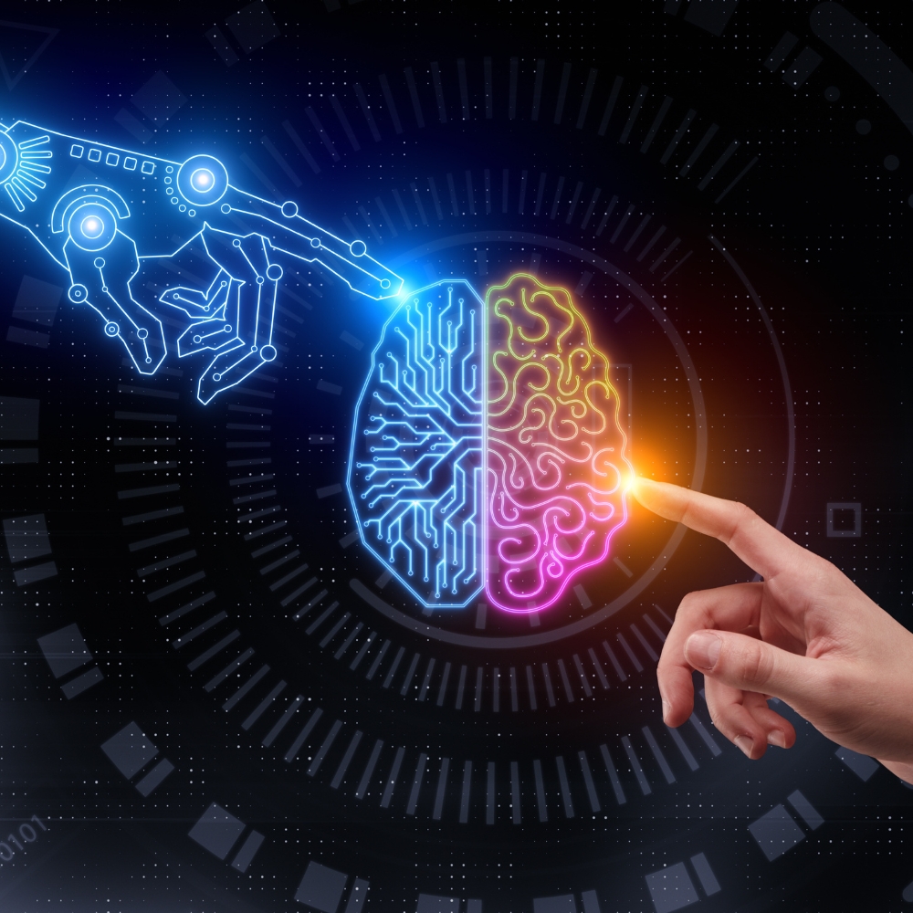 Human brain graphic in the center, with a digital finger touching the brain on one side and a human finger touching the brain on the other side.