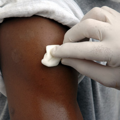 nurse treating patient