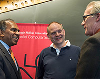 President Subra Suresh and current dean Randal Bryant welcome Andrew Moore (center) back to CMU.
