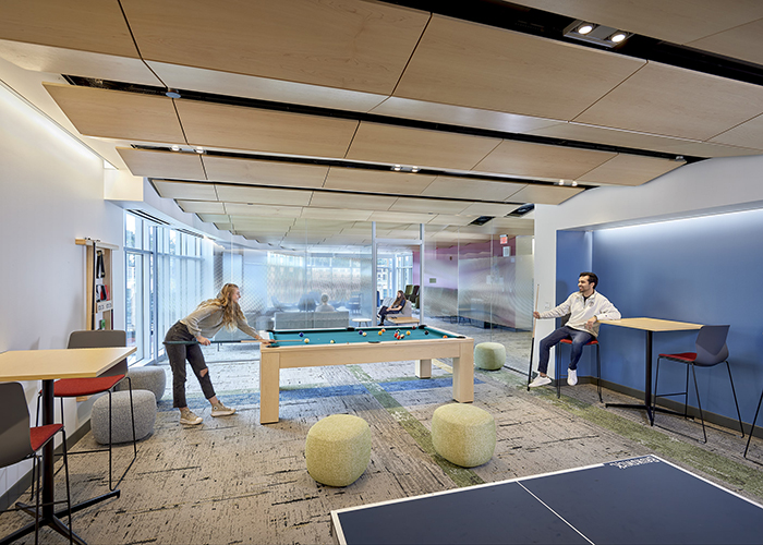 forbes beeler game room with two students playing pool