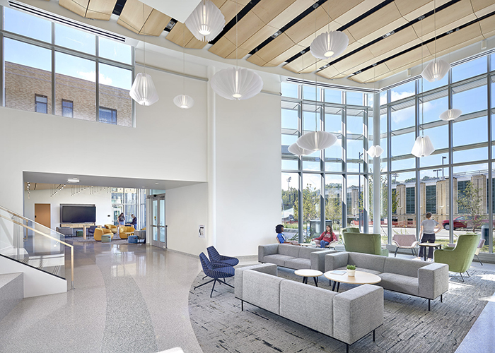 forbes and beeler entry lounge with colorful furniture and lots of windows and natural light