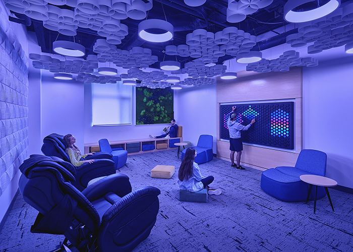 forbes and beeler wellness rooms with light walls and lounge seating