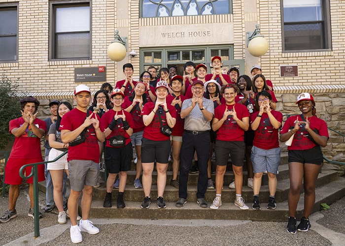 president jahanian poses with students from the MMA neighborhood