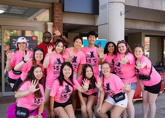 Residence on fifth staff in pink tshirts gather for a photo