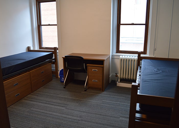 Neville Apartment Double - two beds desks chairs and window