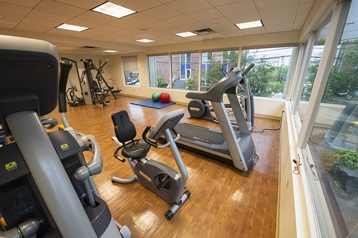 Residence on Fifth Apartments Fitness Room - stationary bike, treadmill, elliptical, and weight machine