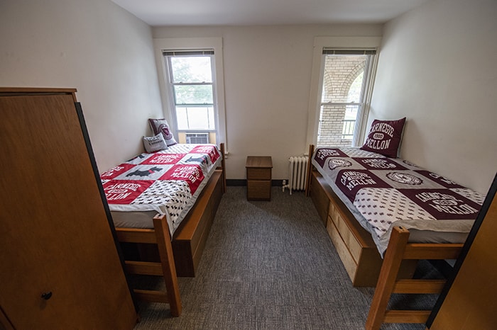 Spirit House Double Bedroom - two beds drawers under beds windows