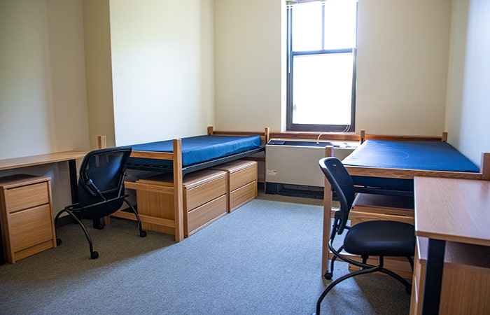 Stever House Double showing two beds, two desks and chairs, and small dressers