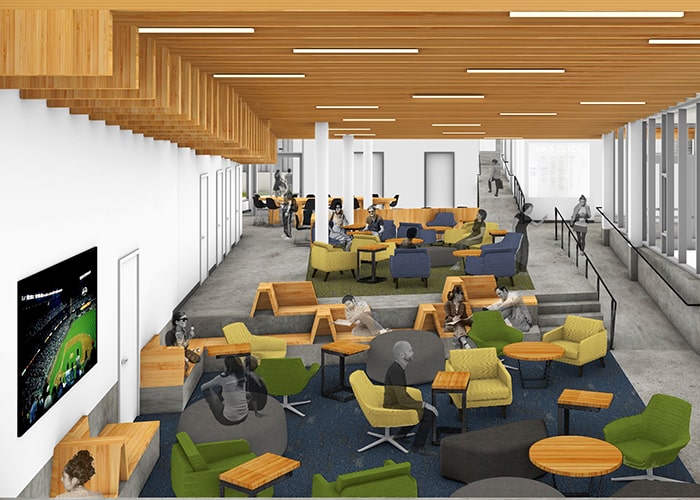 Fifth Clyde Multipurpose room - clusters of chairs a large tv tall ceiling and drawings of students