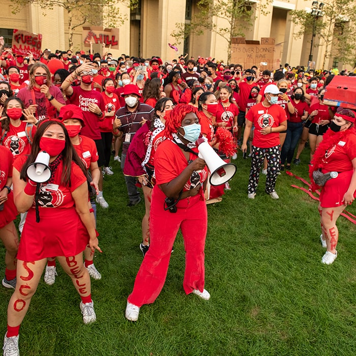 students wearing red and maroon during housewars