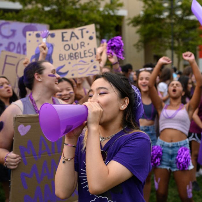 students dressed in purple during housewars
